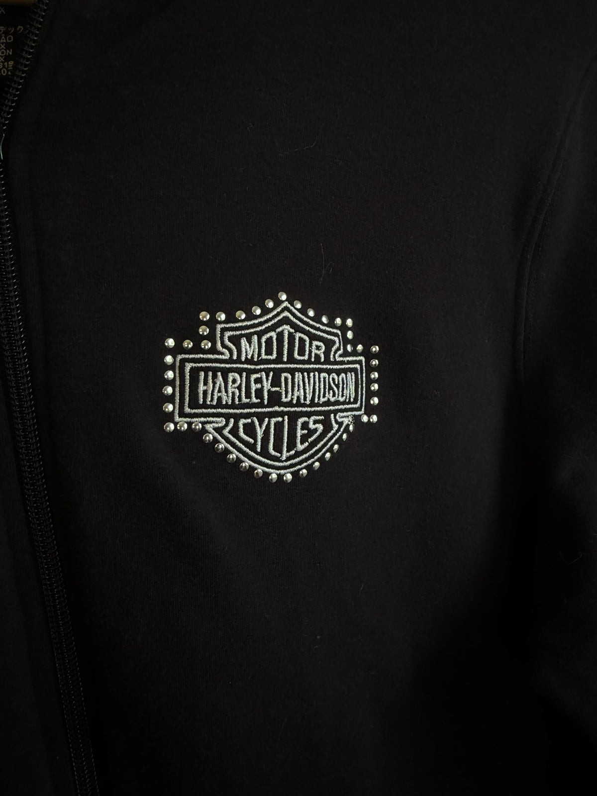 225 Threadz black Harley-Davidson zip-up hoodie featuring an embroidered shield logo with silver stud accents
