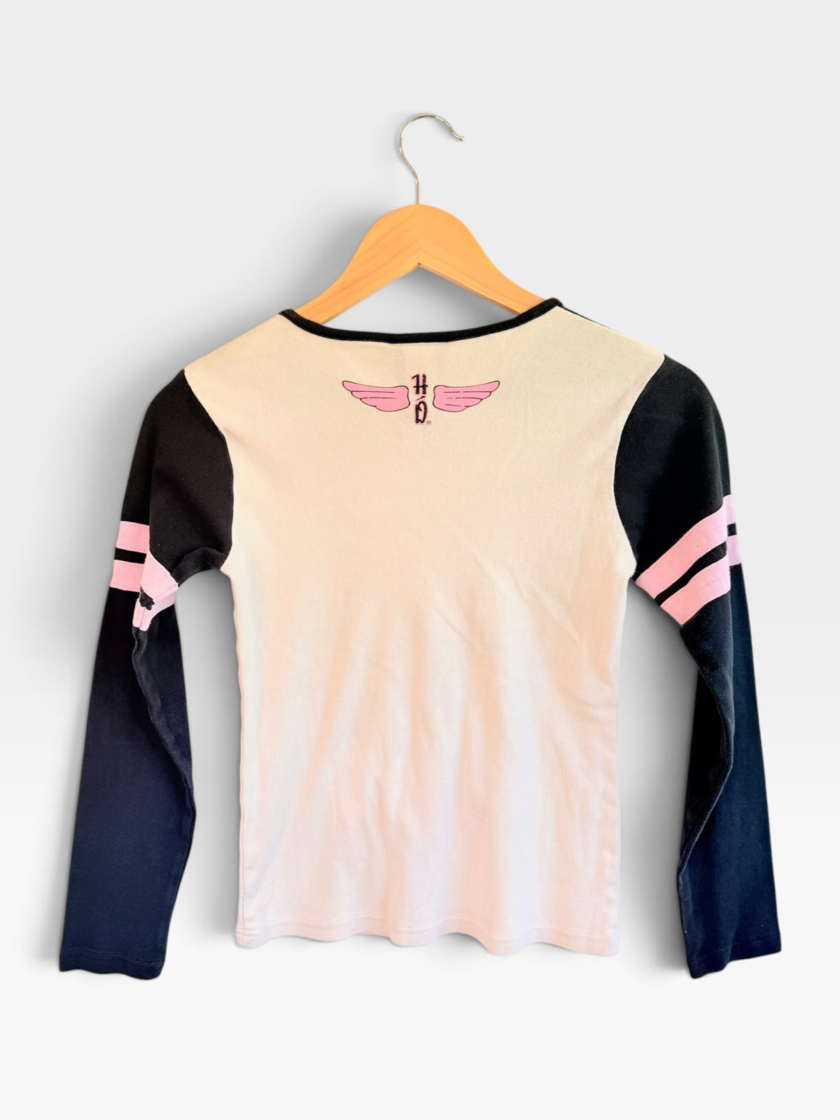 Back view of 225 Threadz Harley-Davidson long sleeve tee with white body, black sleeves, pink stripes, and winged logo.