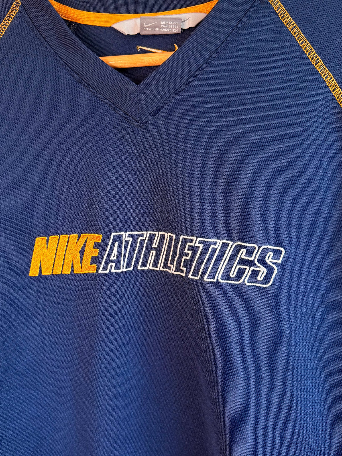 225 Threadz vintage navy blue Nike Athletics performance pullover with gold contrast stitching and V-neck collar