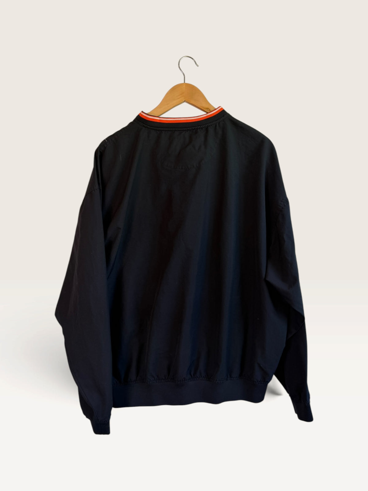 225 Threadz Oklahoma State Nike black pullover windbreaker with orange and white striped V-neck collar, back view.