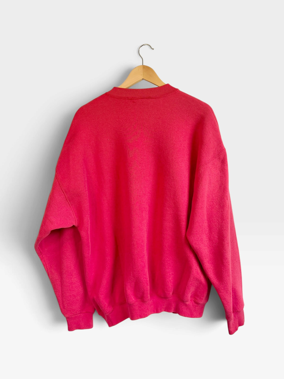 225 Threadz red Kansas City Chiefs vintage style crewneck sweatshirt back view hanging on a wooden hanger