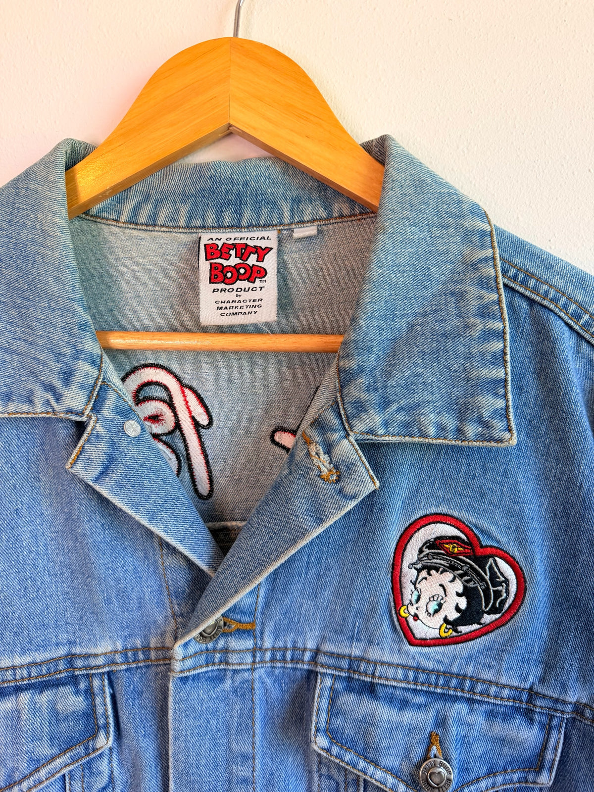 225 Threadz light-wash denim jacket featuring a Betty Boop heart patch and official branded inner neck label