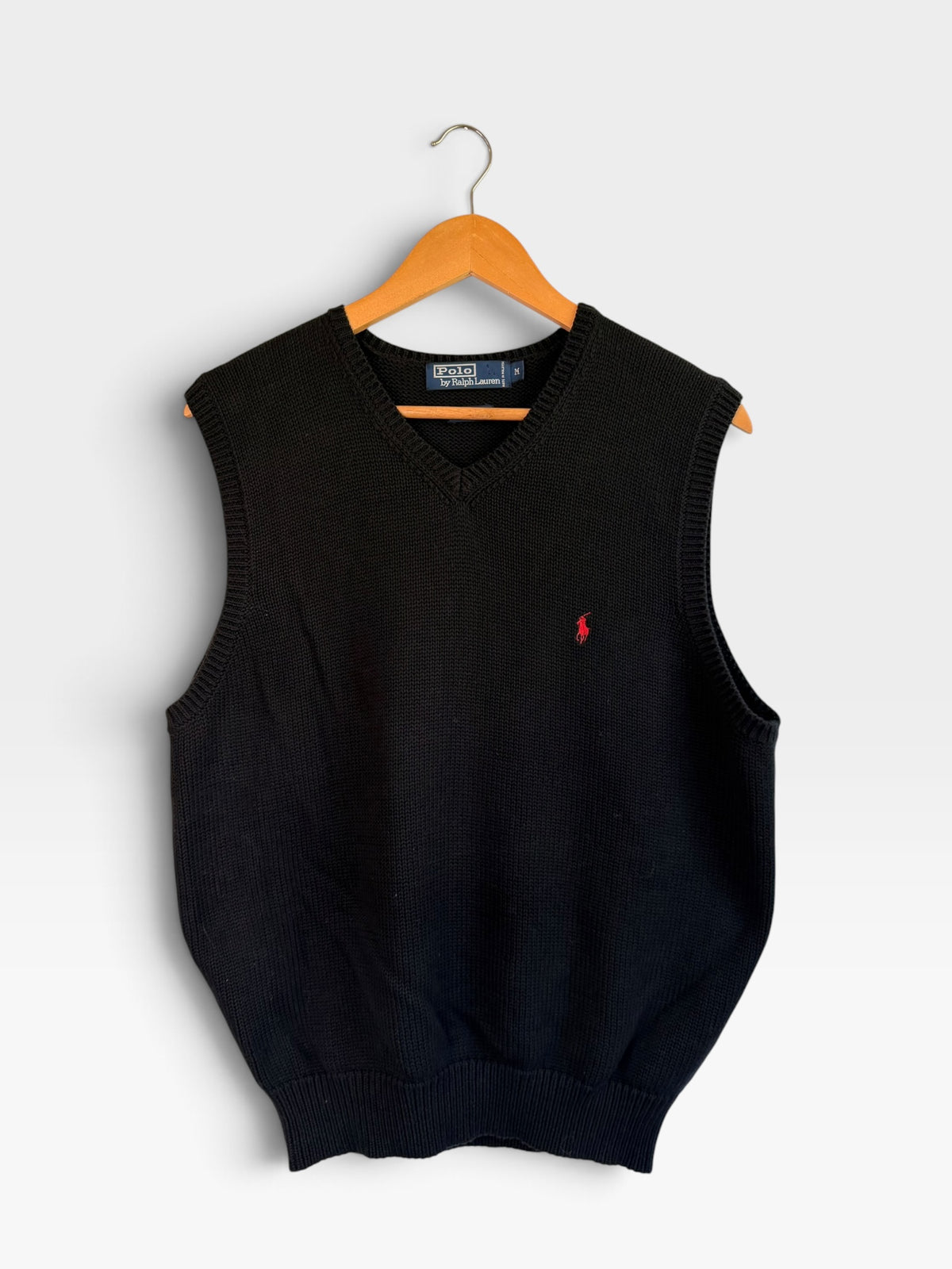 225 Threadz black Polo Ralph Lauren V-neck knit sweater vest with red embroidered pony logo on a wooden hanger