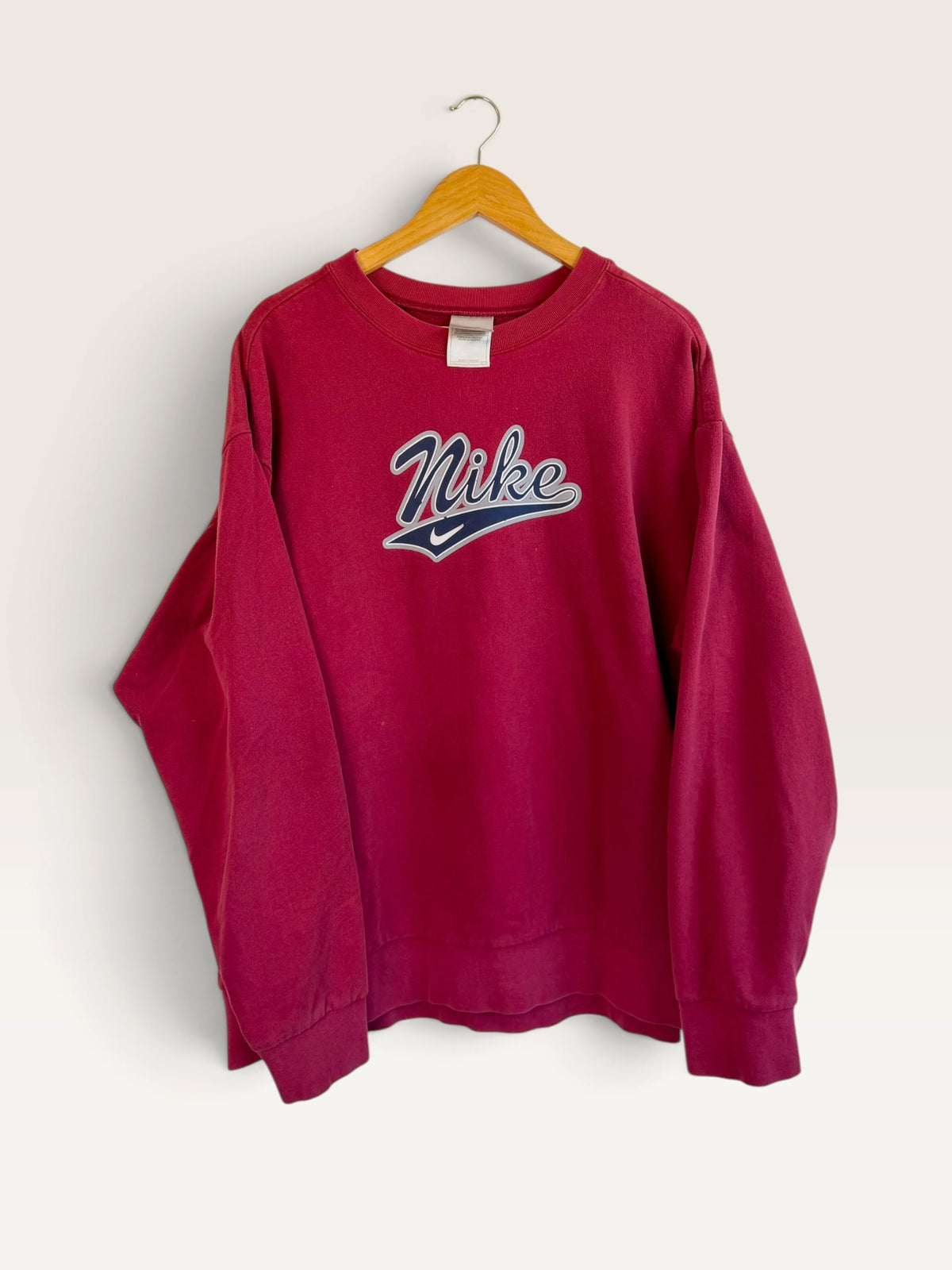 225 Threadz vintage burgundy Nike crewneck sweatshirt with embroidered script logo on a wooden hanger