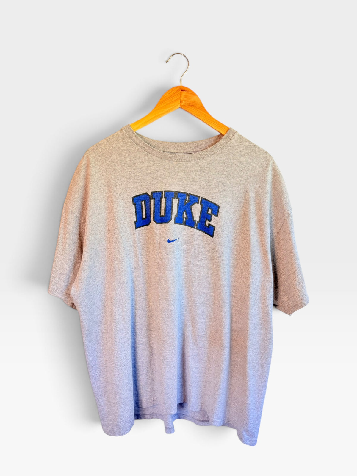 225 Threadz heathered grey Duke University crewneck t-shirt with blue wordmark and embroidered Nike logo on a hanger