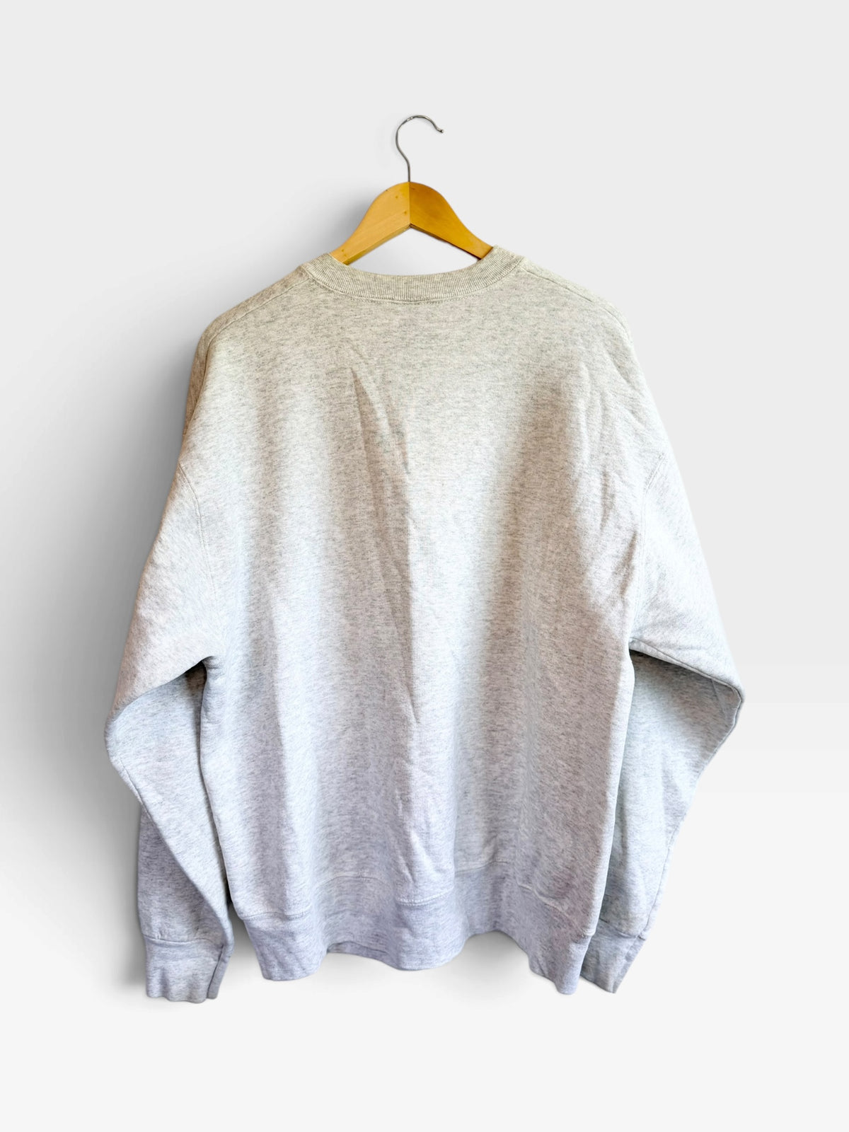 Back view of a 225 Threadz vintage grey cotton-blend crewneck sweatshirt hanging on a wooden hanger