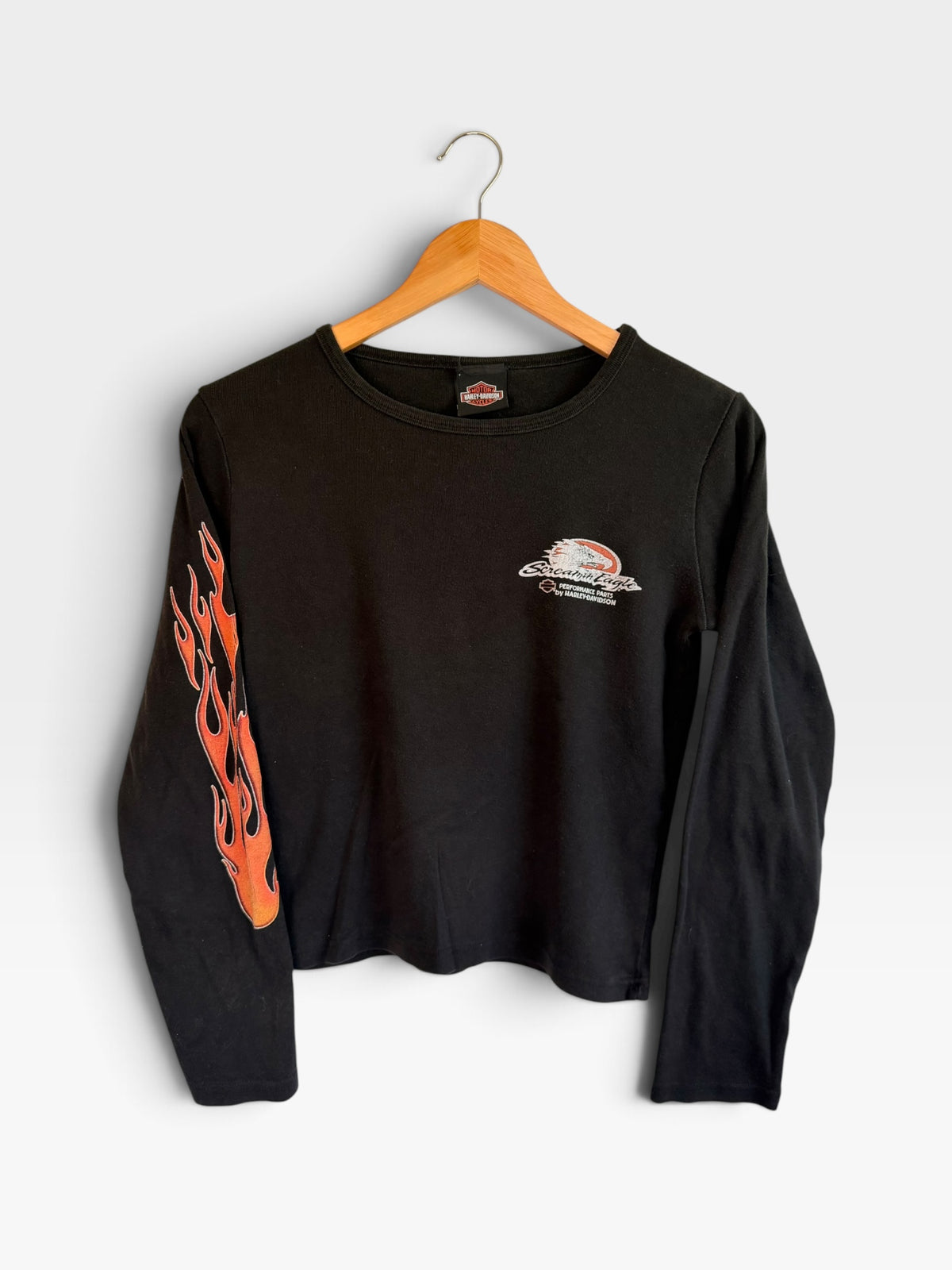 225 Threadz black long sleeve Harley-Davidson crewneck shirt with orange flame graphics on the right sleeve.