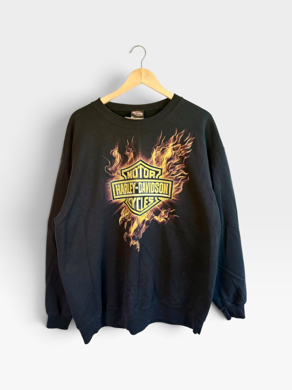 225 Threadz black Harley-Davidson crewneck sweatshirt featuring a fiery Bar and Shield logo graphic on the front.