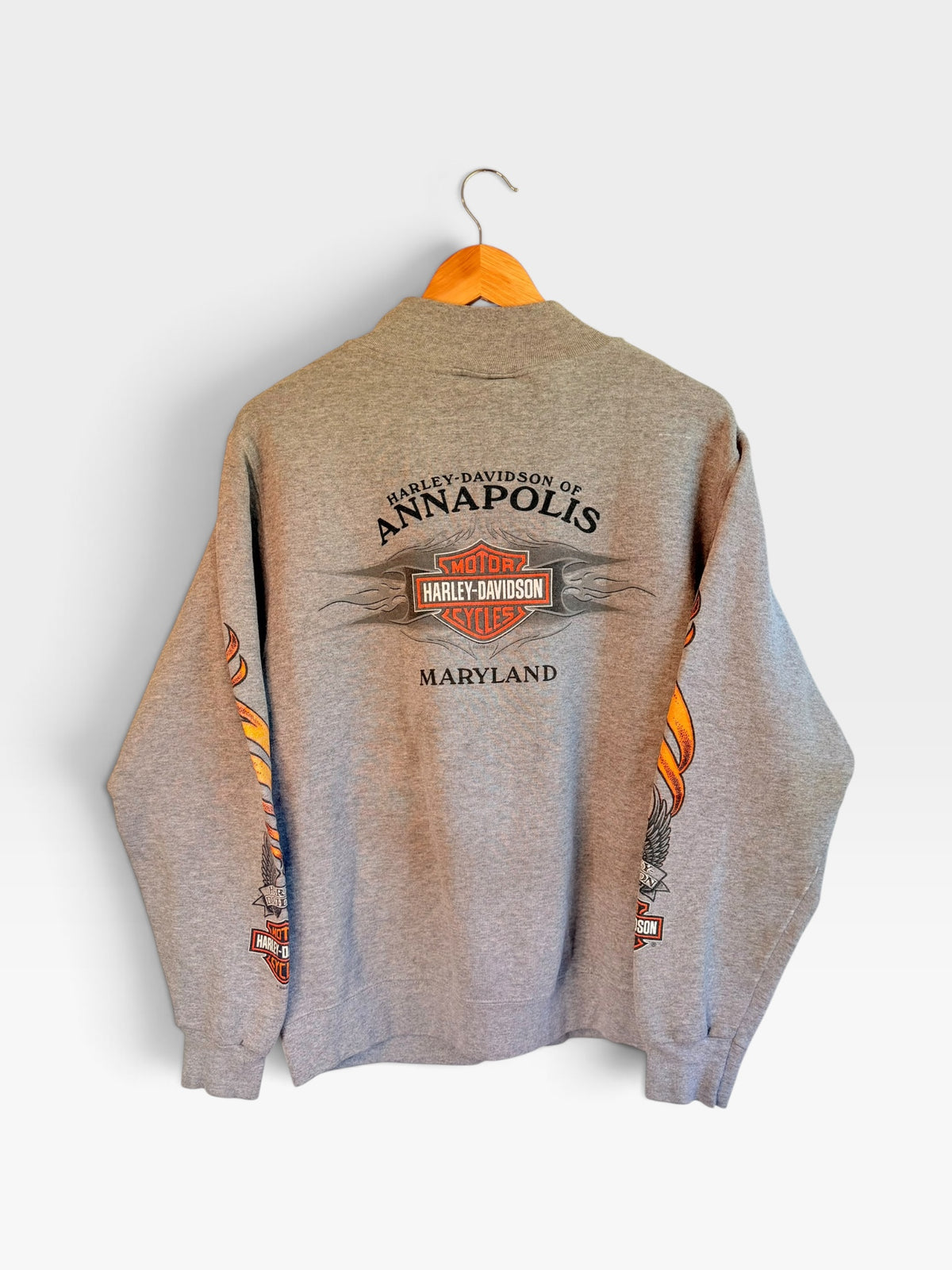 225 Threadz grey Harley-Davidson Annapolis Maryland fleece sweatshirt with flame sleeve graphics on a wooden hanger