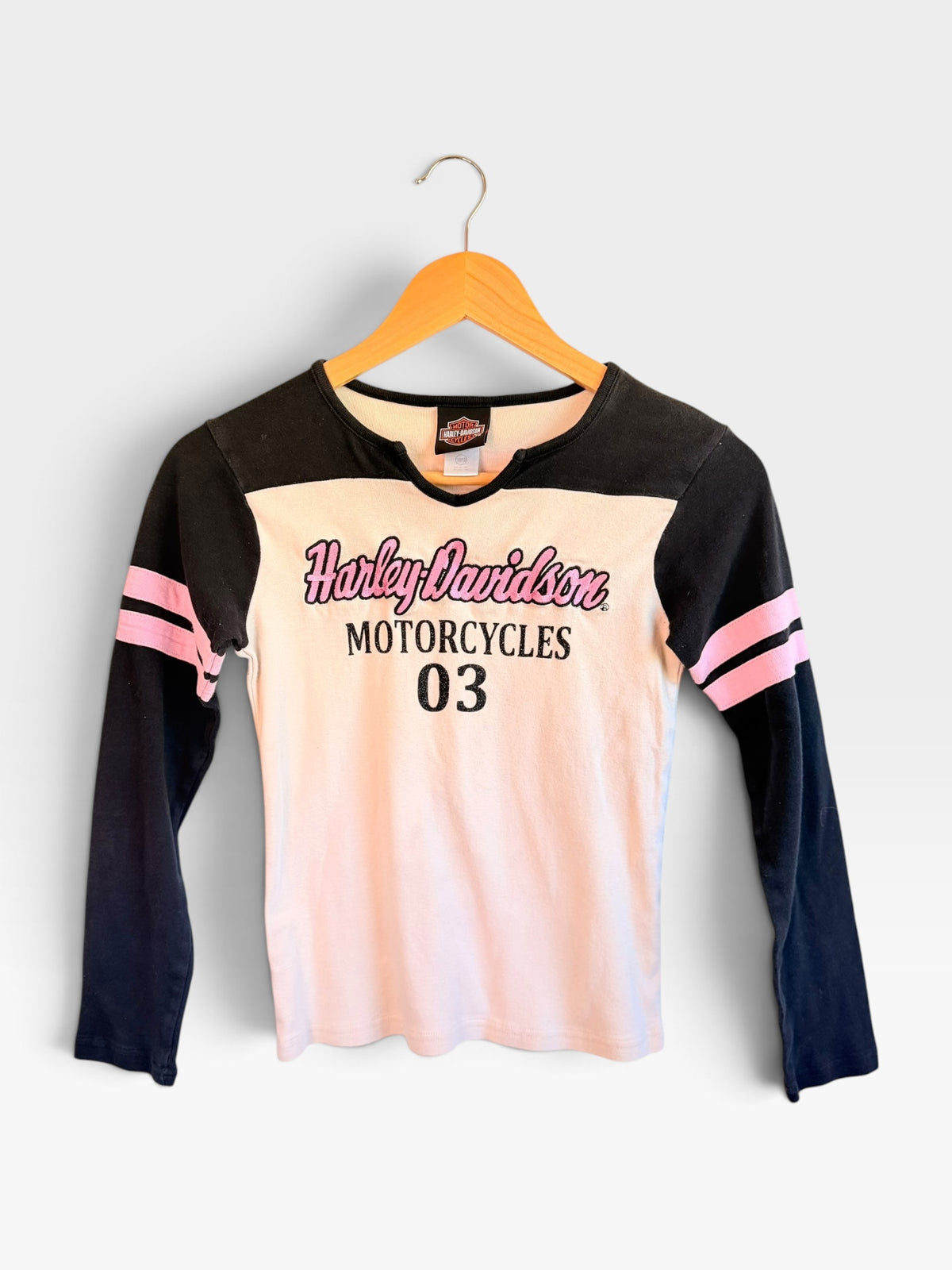 225 Threadz Harley-Davidson long sleeve notch-neck tee in white and black with pink racing stripes and retro graphic.
