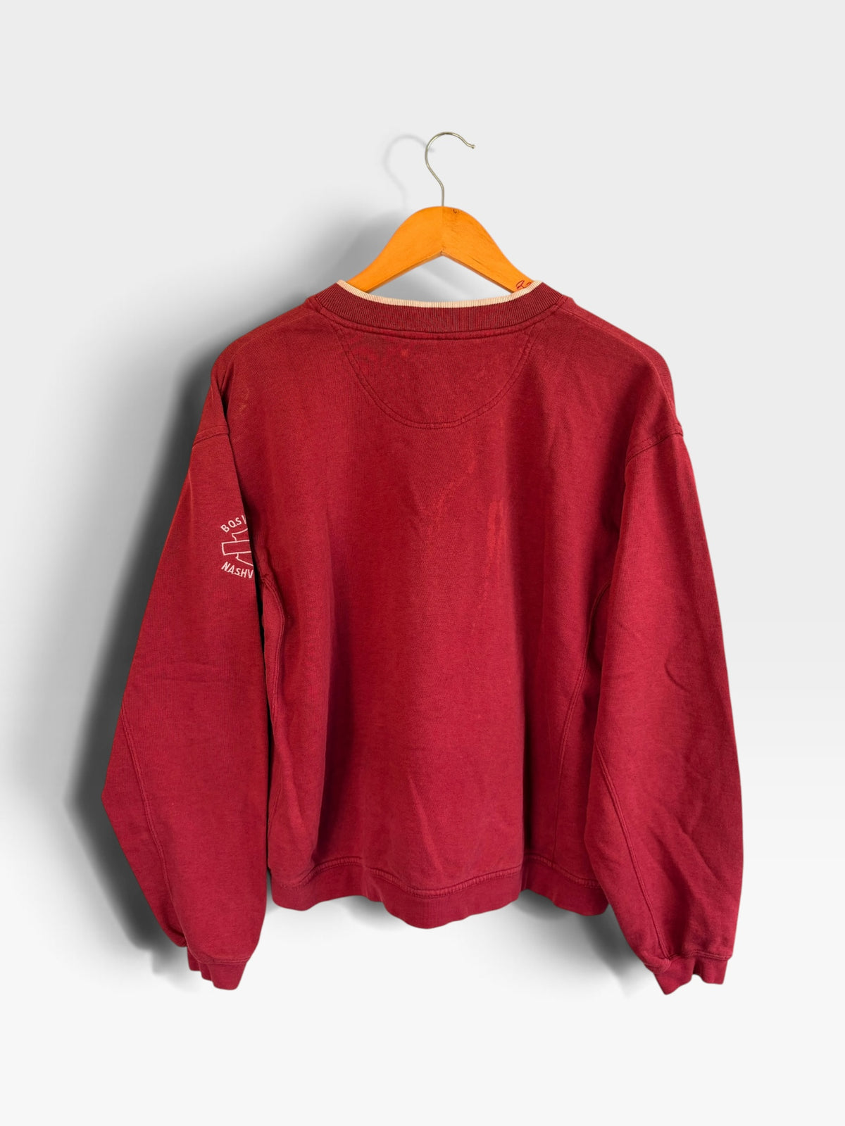 Back view of a deep red 225 Threadz Harley-Davidson pullover sweatshirt with ribbed cuffs and sleeve logo detail.