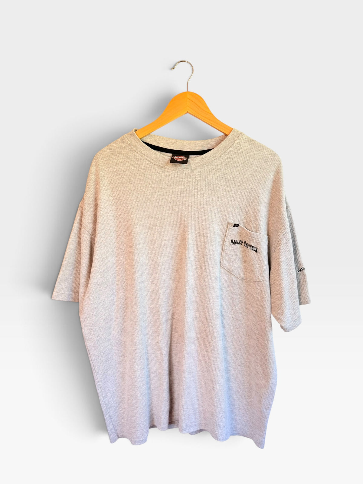 225 Threadz light grey waffle-knit Harley-Davidson pocket t-shirt with ribbed crew neck hanging on a wooden hanger