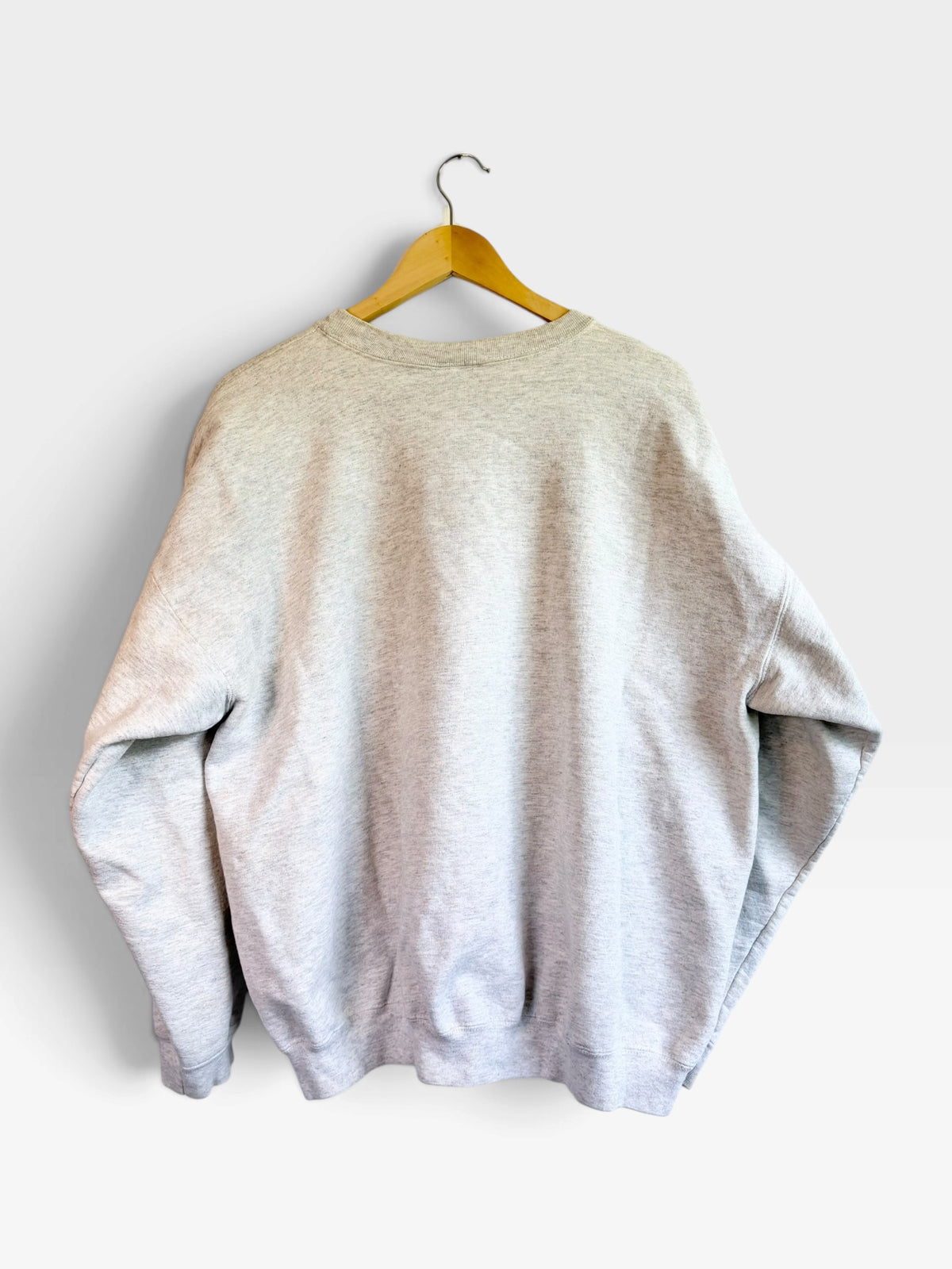 225 Threadz vintage heather grey crewneck sweatshirt hanging on a wooden hanger, back view