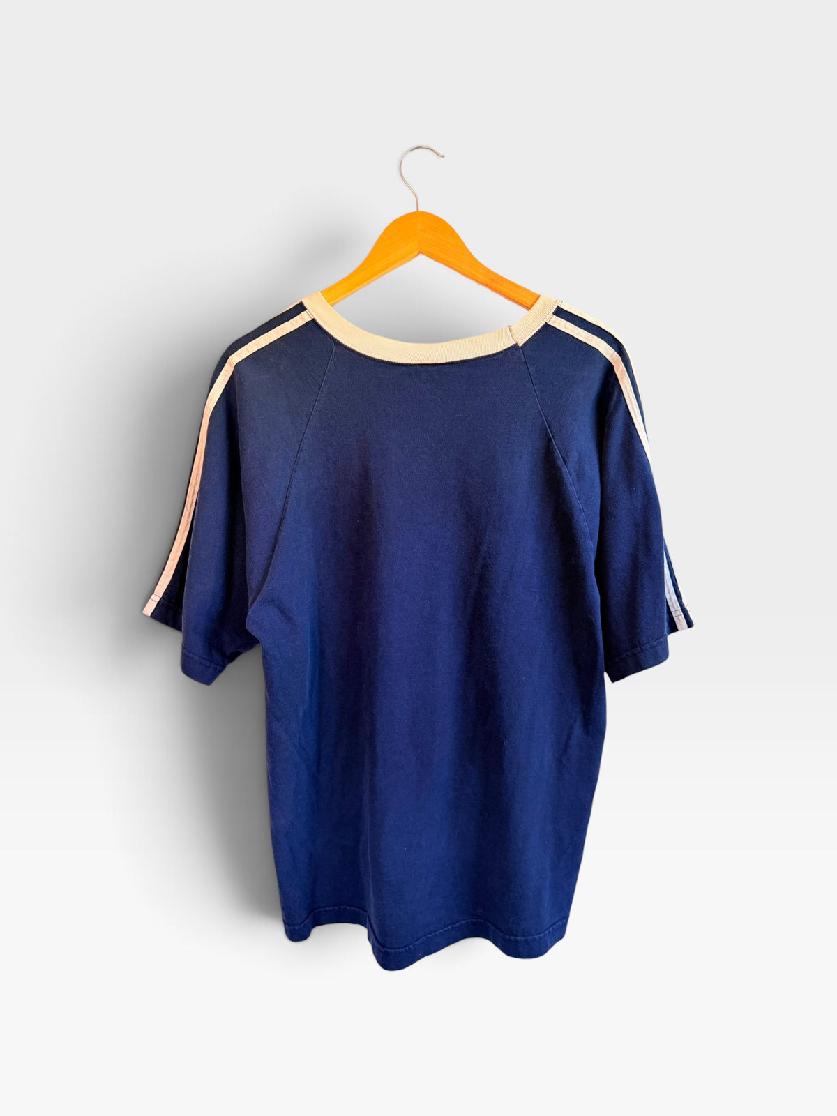 225 Threadz navy blue vintage-style cotton t-shirt with cream V-neck collar and athletic shoulder stripes