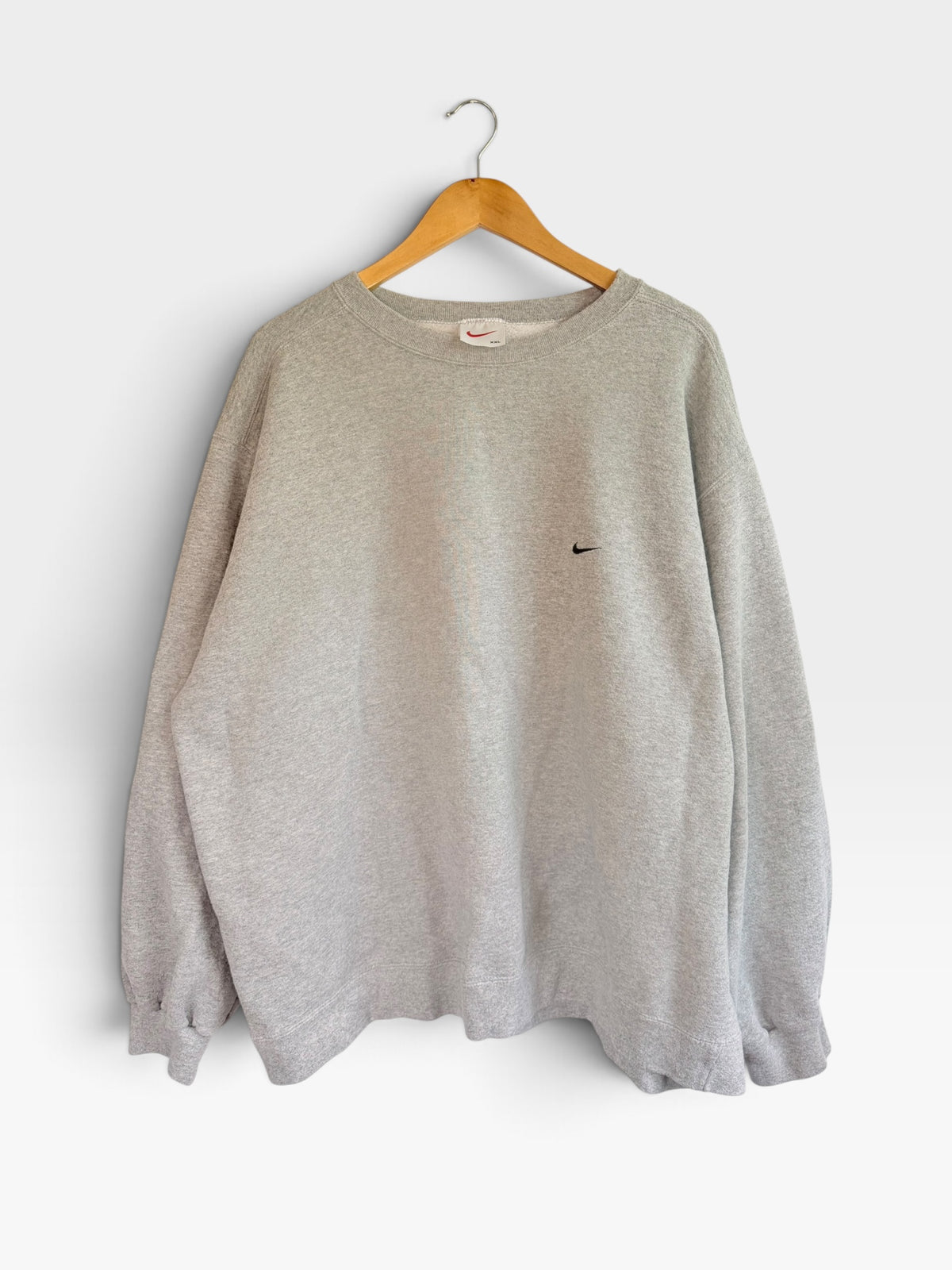 225 Threadz heather grey Nike crewneck sweatshirt with embroidered Swoosh logo on a wooden hanger