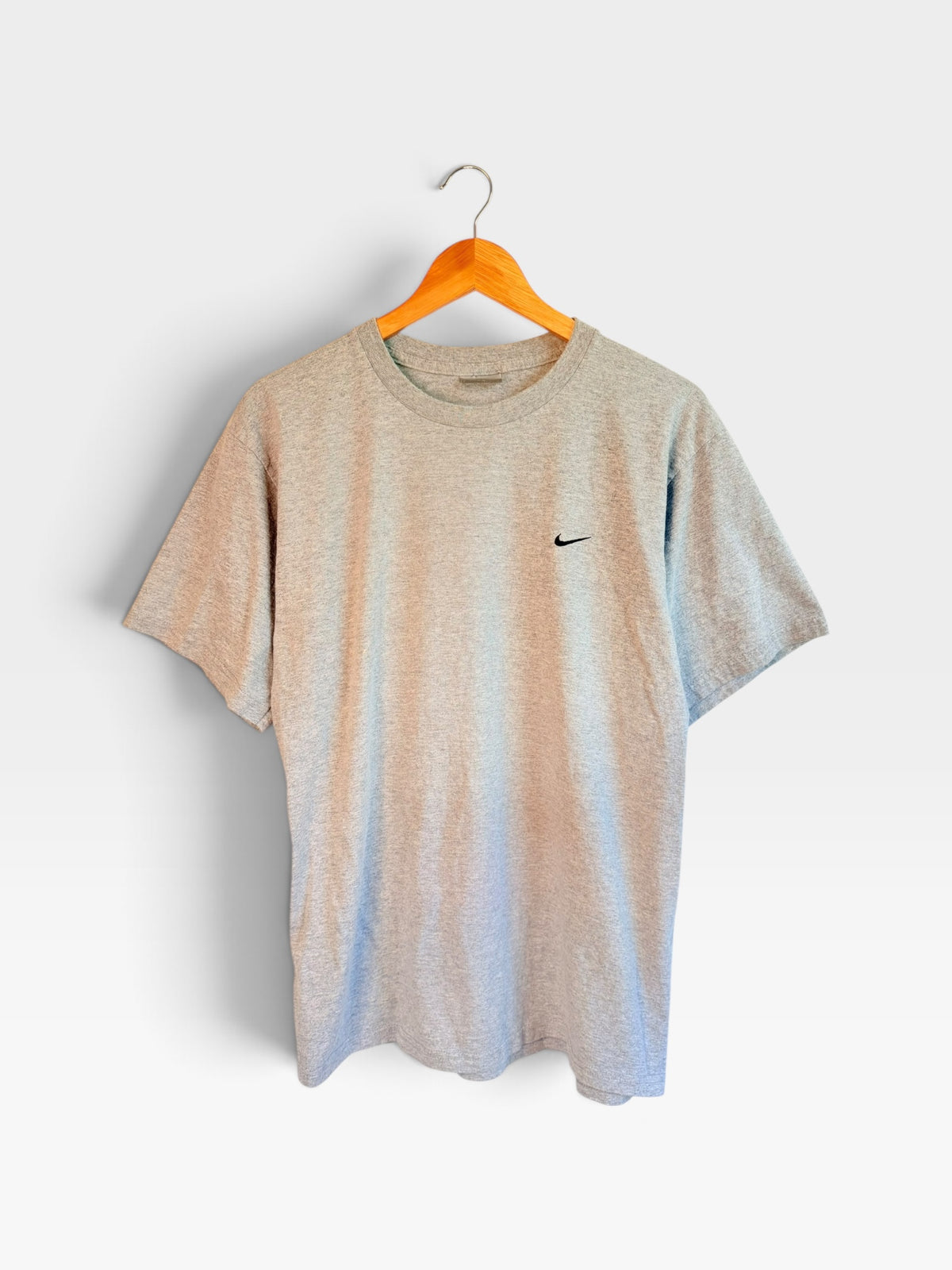 225 Threadz grey heather Nike crew neck t-shirt with small embroidered logo hanging on a wooden hanger