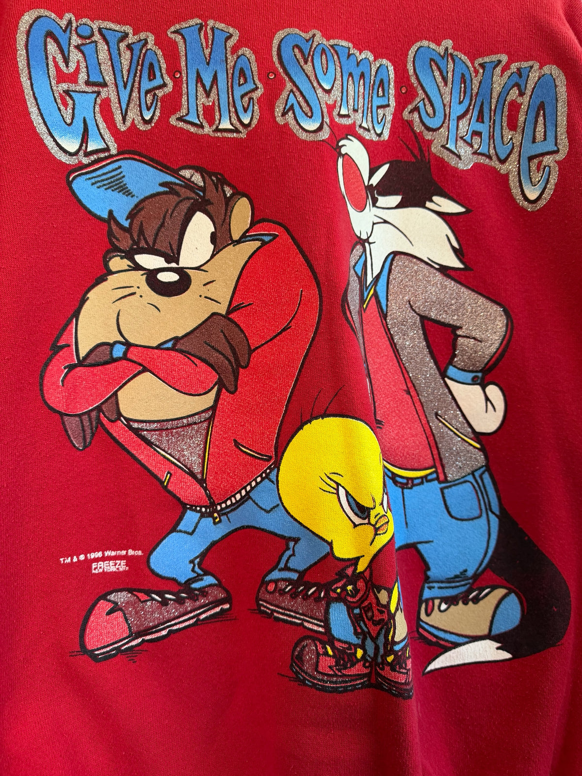 225 Threadz red crewneck sweatshirt featuring a vintage Looney Tunes graphic with Taz, Sylvester, and Tweety Bird.