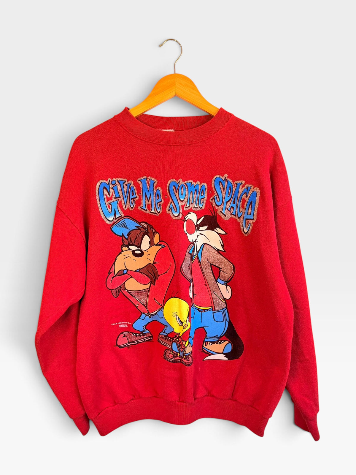 225 Threadz red Looney Tunes graphic crewneck sweatshirt featuring Taz, Sylvester, and Tweety Bird with glitter text.